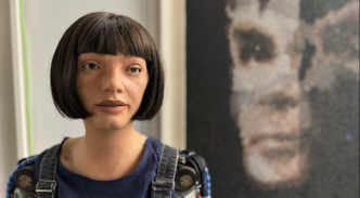 'AI God' portrait of Alan Turing by Aida humanoid robot