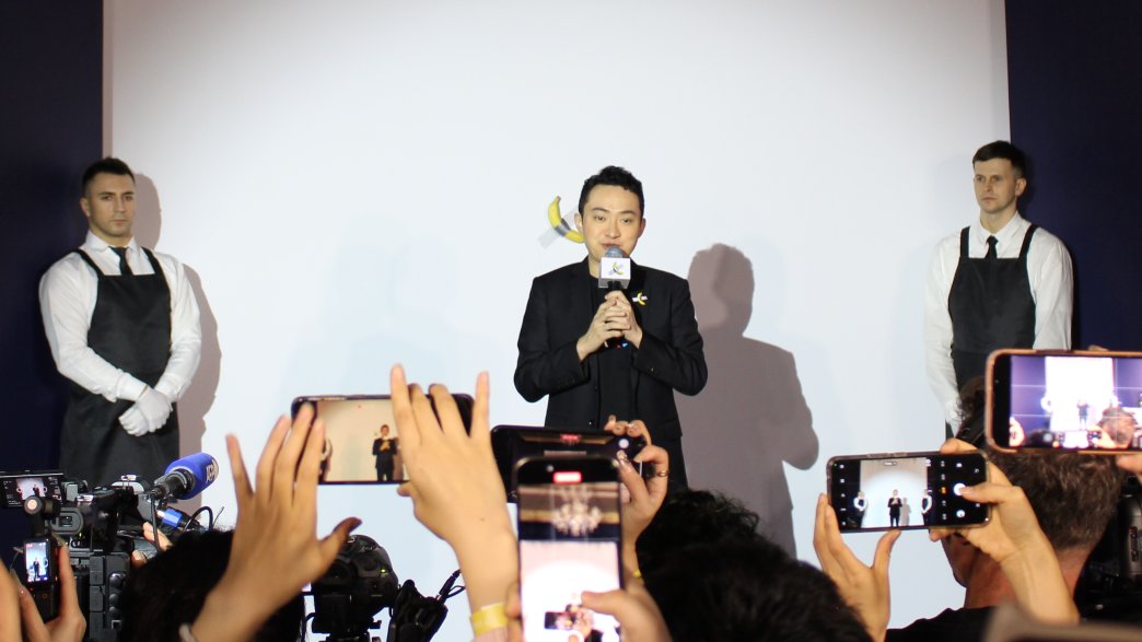 Justin Sun eats the world's most expensive banana at an event in Hong Kong.