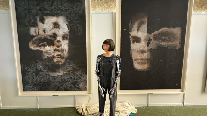 'AI God' portrait of Alan Turing by Aida humanoid robot