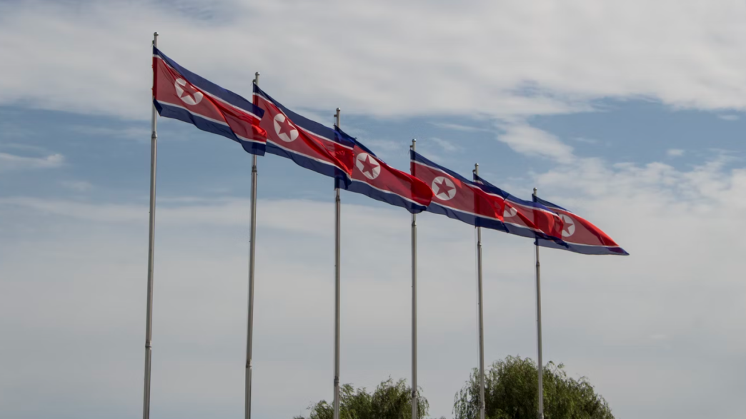 North Korean flags waving in the wind.