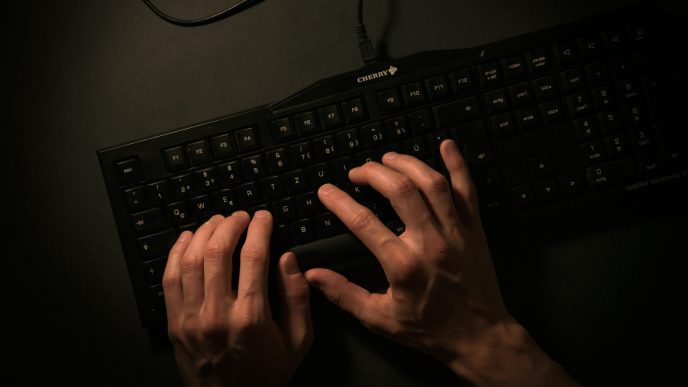 Cybercrime fingers typing